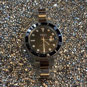 TKO watch black face clear silver strap toy watch